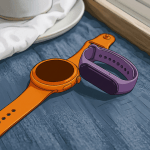 Smartwatch and purple fitness tracker on blue fabric beside a coffee cup